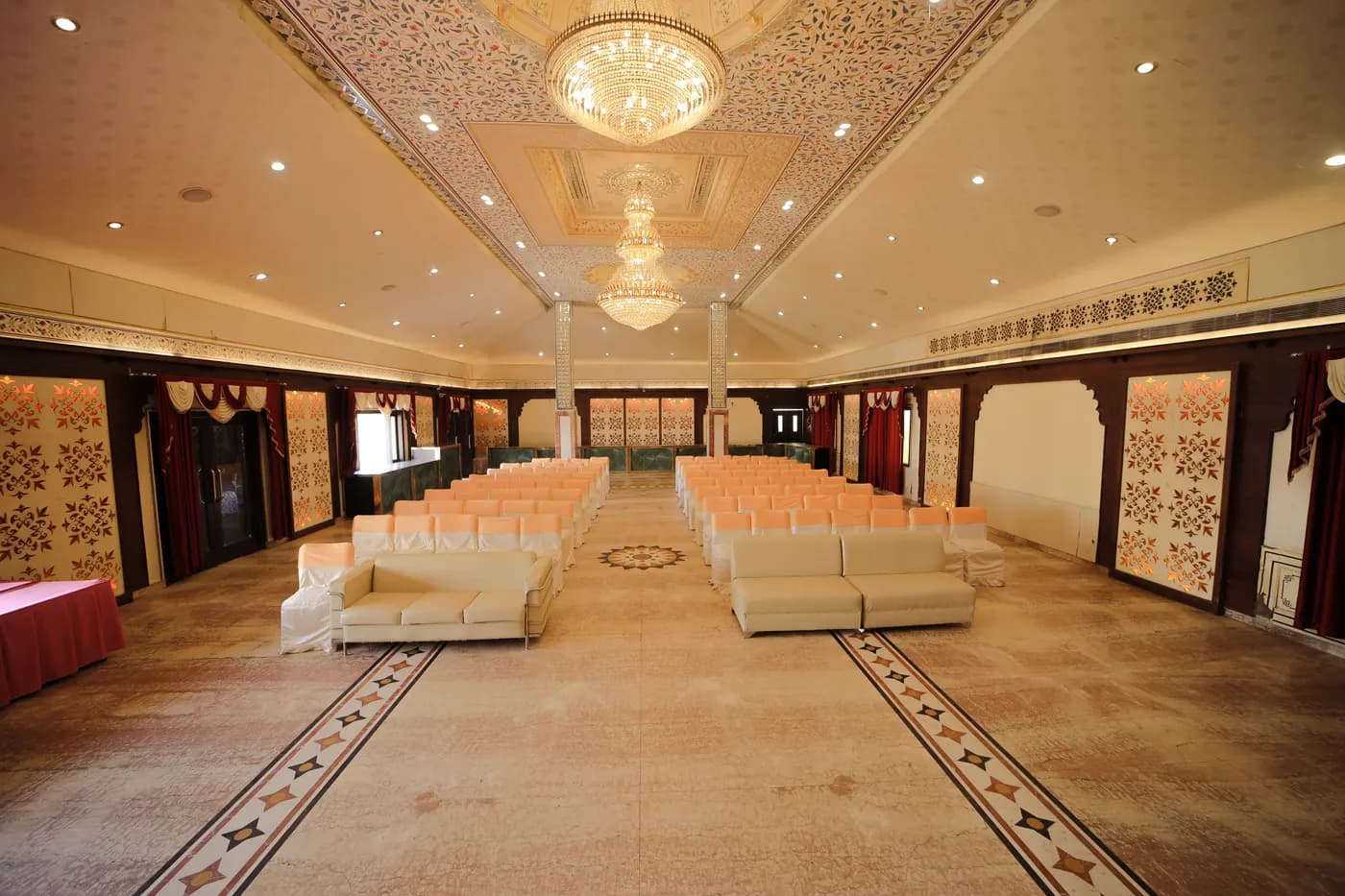 Grand banquet hall with chandeliers at Cheelgadi Jaipur